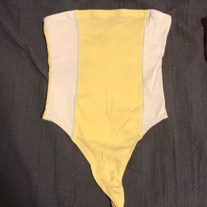 Yellow tube top body suit